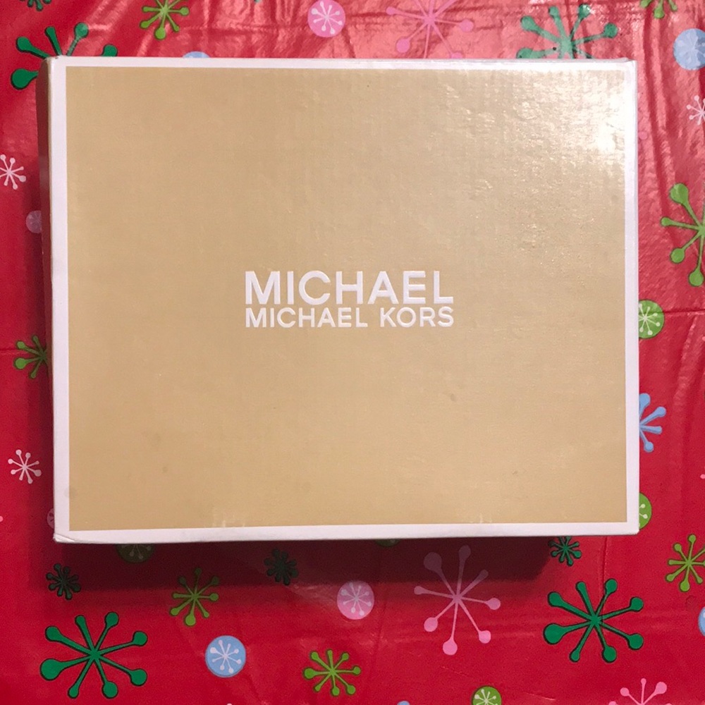 Michael Kors size 1 girls slightly used. One small spot peeled on front of one